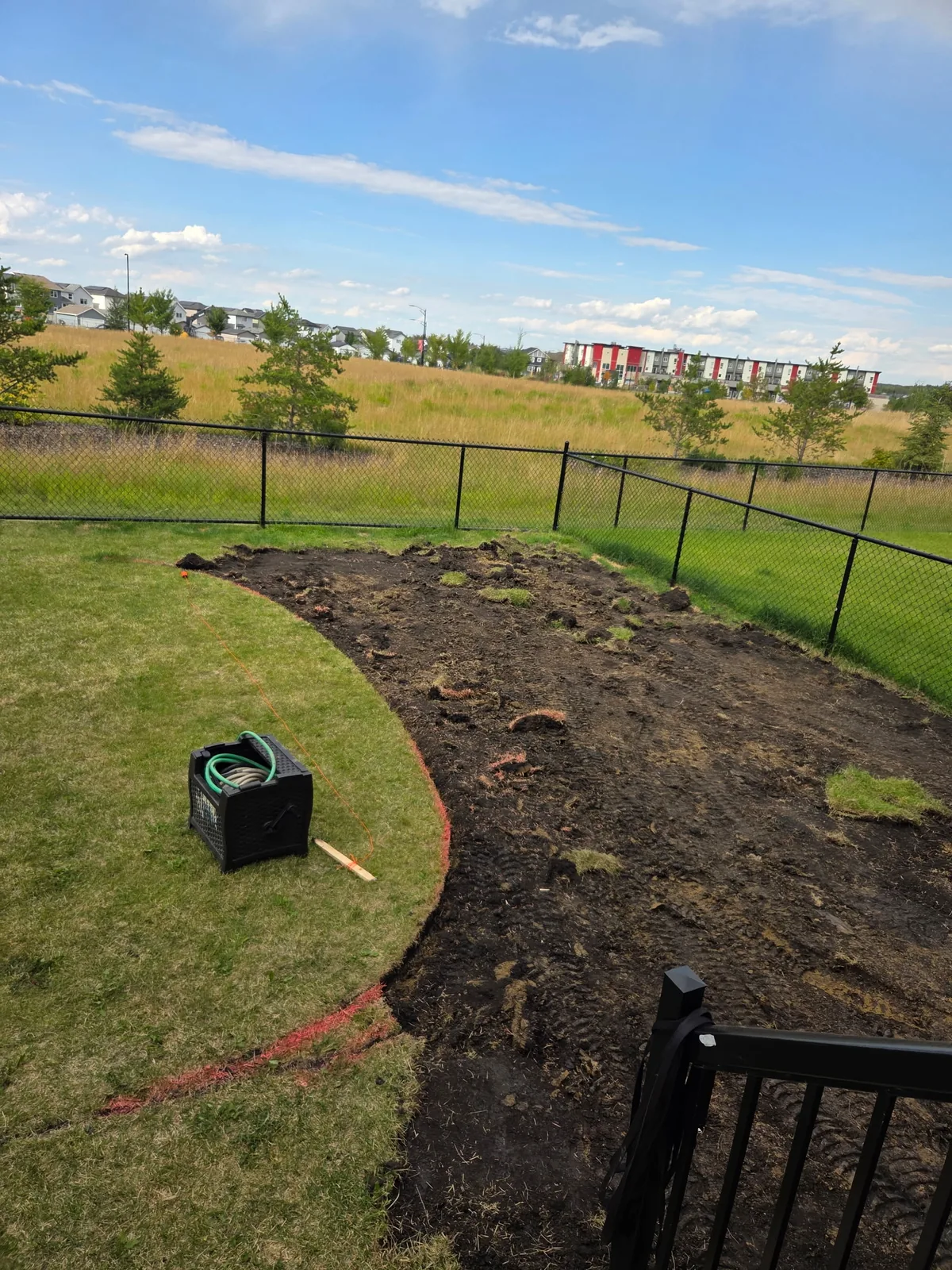 Curved landscape beds being excavated and shaped