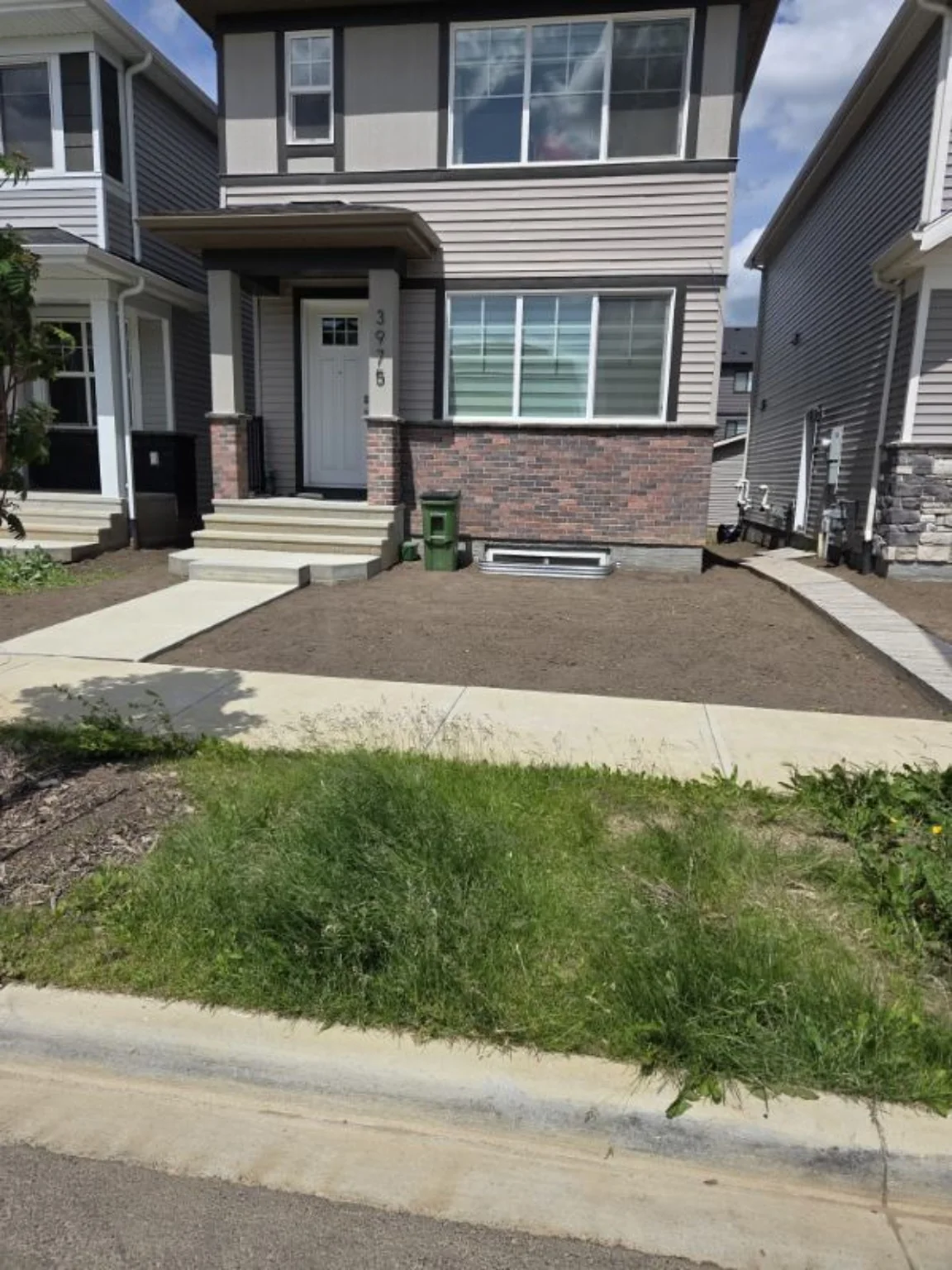 Front yard prepared to final grade before sod installation
